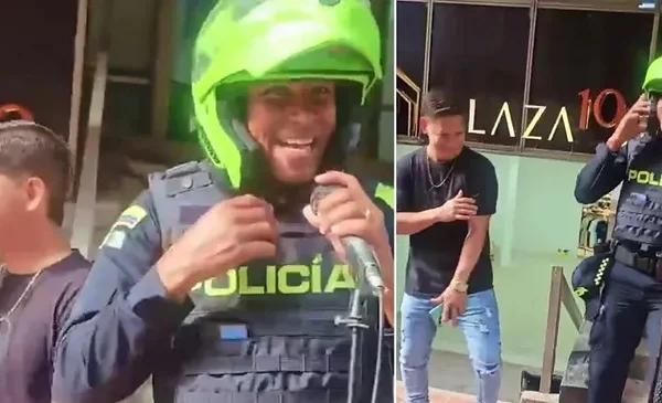 Un policía sorprende al artista callejero al cantar junto a él